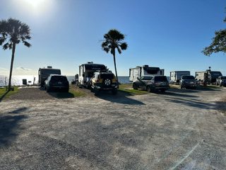 A Group of Vehicles Parked in a Parking Lot