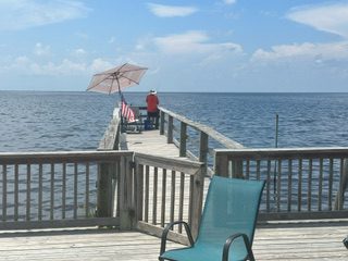 A Person Fishing on a Dock