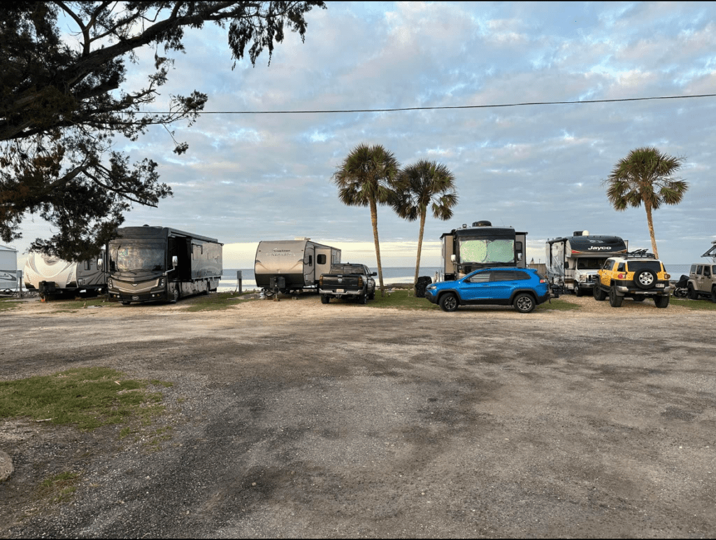 A Group of Rvs Parked in a Parking Lot